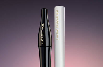 A black and a white eyeliner pencil positioned against a gradient background, showcasing their sleek designs and brand labels.