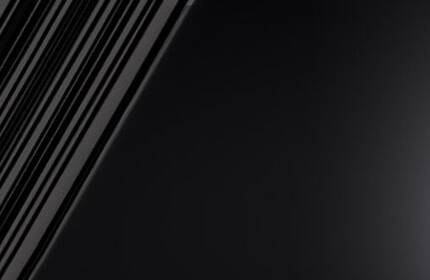 A close-up of a sleek black mascara tube next to a mascara wand, set against a gradient background that transitions from dark to light.