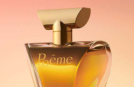 A stylish perfume bottle with a golden cap and a soft gradient background in warm tones. The bottle is elegantly shaped and features the name "Reve" in a stylish font.