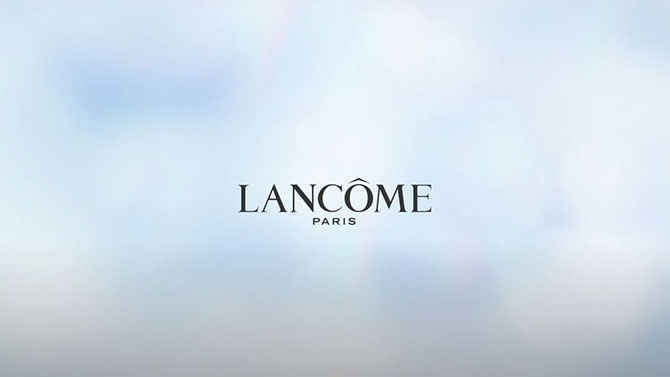 The image features the logo of Lancome Paris against a soft, blurred background.