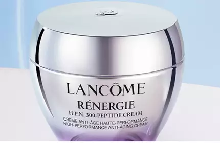 Two jars of Lancome's Renergie Multi-Lift Ultra cream are displayed against a soft purple background.