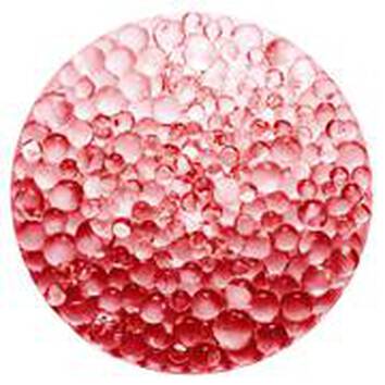 Gocce di acqua rosa su uno sfondo circolare, creando un effetto di texture e luminosita.