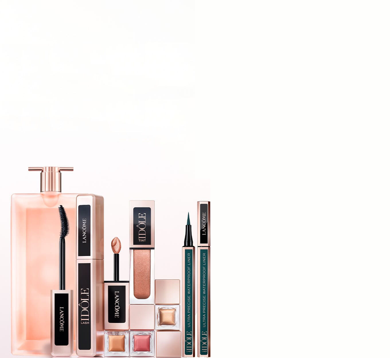 Immagine di una selezione di prodotti di bellezza Lancome, tra cui profumo, mascara, rossetto e eyeliner, su uno sfondo chiaro.