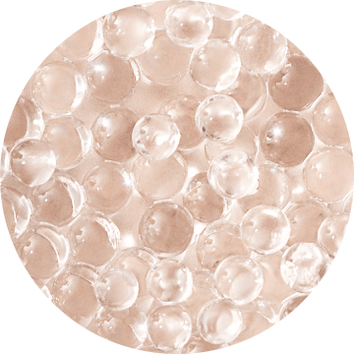Piccole palline trasparenti su uno sfondo chiaro, creando un effetto di profondita e lucentezza.